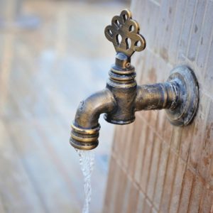 the-bronze-tap-with-flowing-water-vintage-old-fauc-PRSQ3DS-min